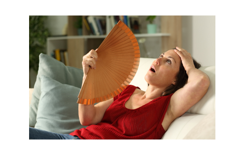 Hormonal imbalanced women having a hot flash.