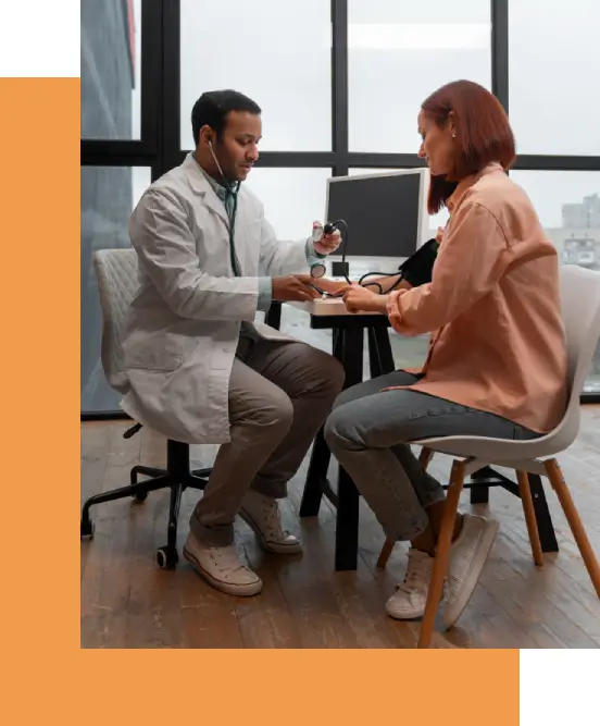 Consultation for integrative therapies at a clinic for functional medicine in Philadelphia. Functional medicine clinician reviews factors including age, genetics, environment, and lifestyle to develop a personalized treatment plan.