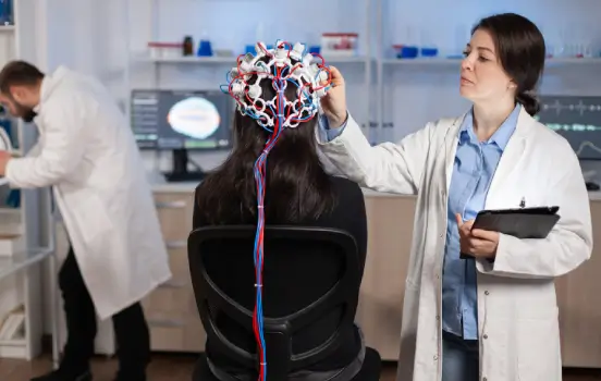 Clinician and patient during a precision neuro-restoration treatment at Philly Wellness Center for restoring brain health.